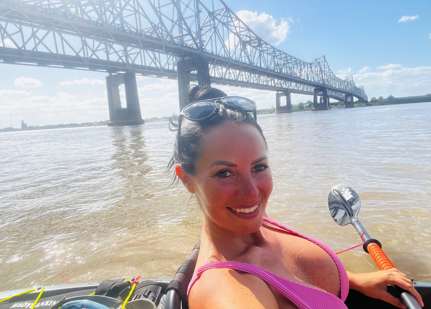 Your guide kayaking on the Mississippi River under the Natchez bridge